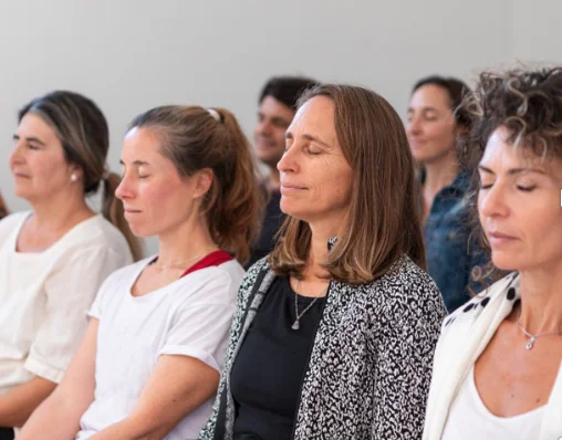 A group gathered in meditation